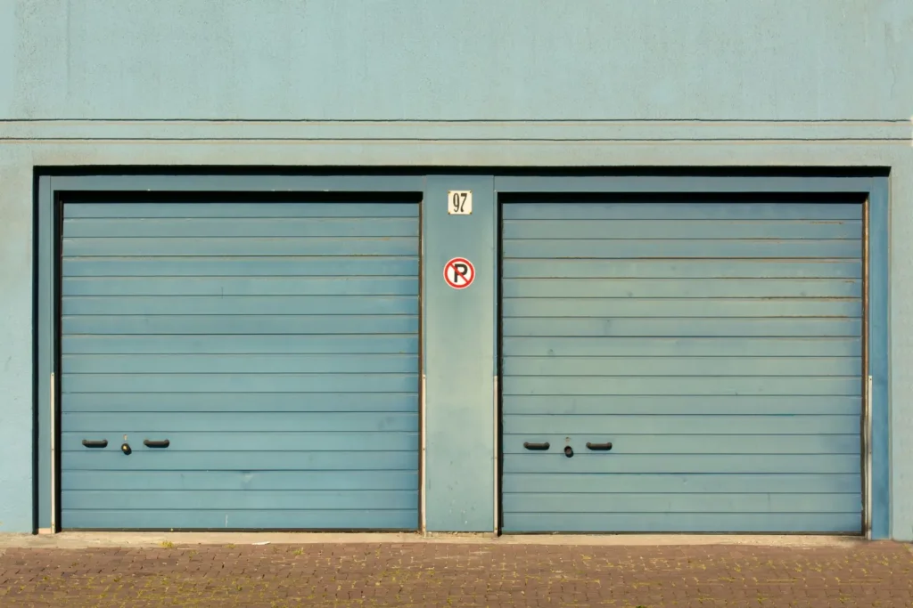 Blue garage doors on a residential building
