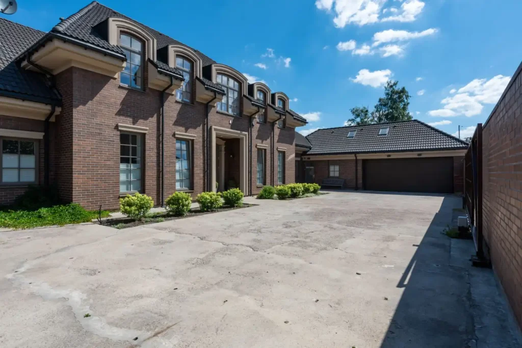 Brick house exterior with a large driveway