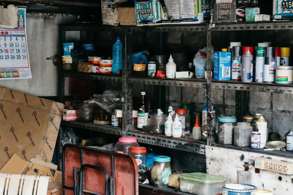 Cluttered garage interior with shelving