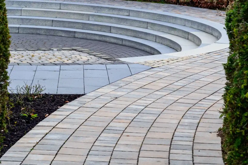 Curved brick pathway to a seating area