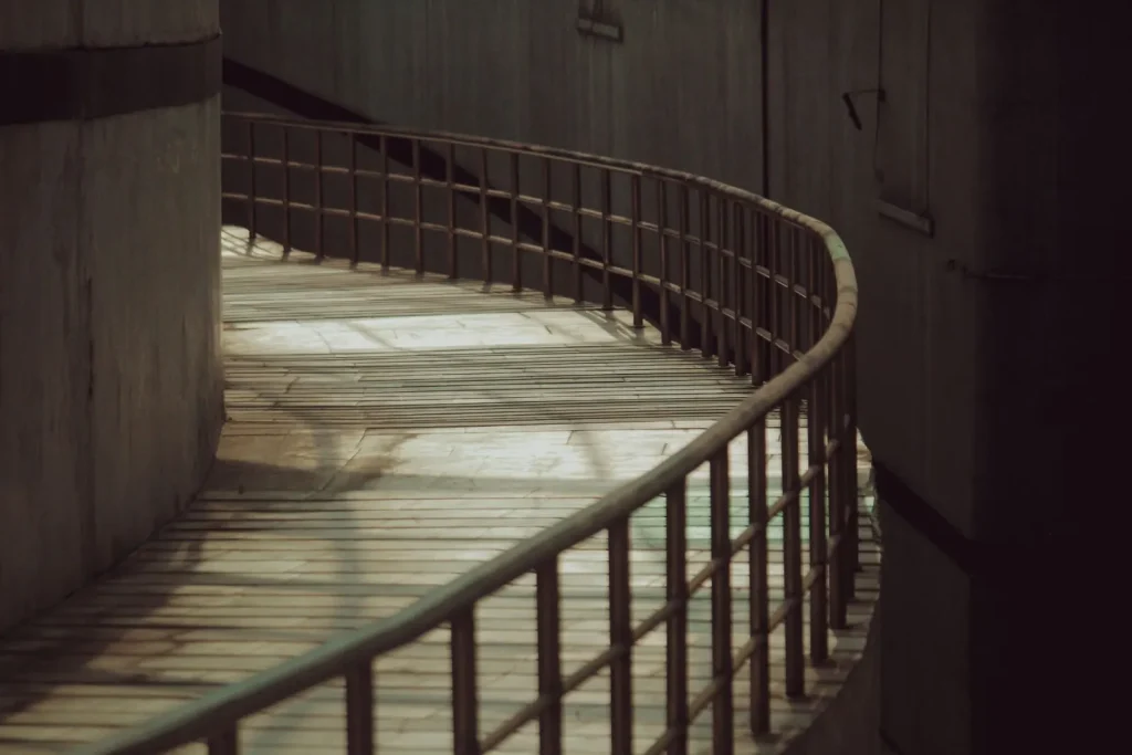 Curved wooden pathway with railings