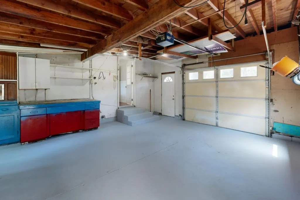 Empty garage with storage cabinets