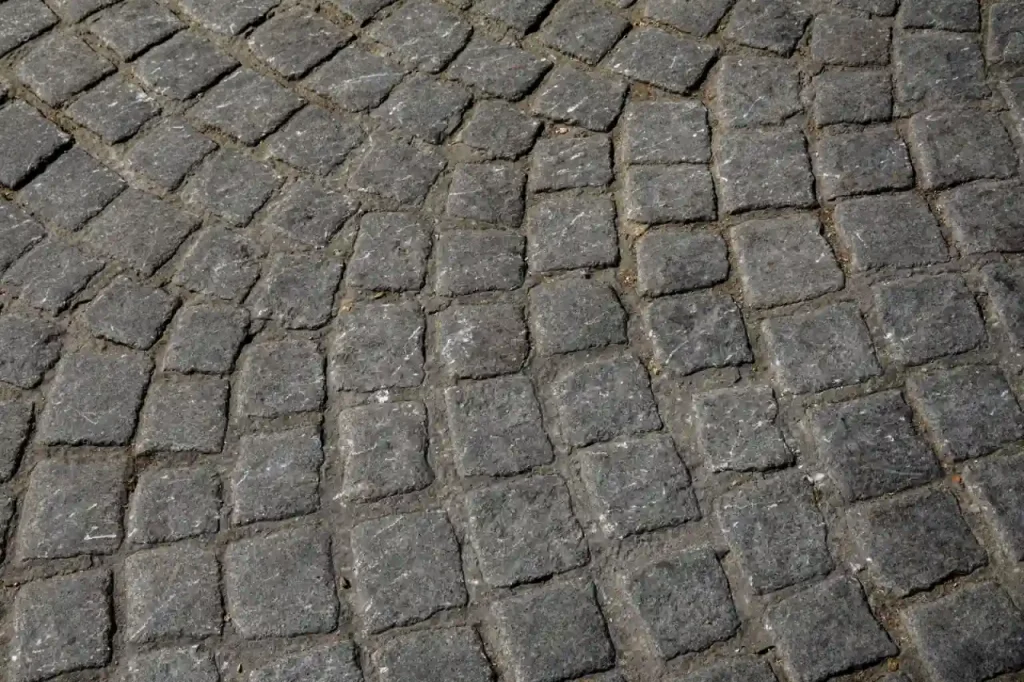 Grey cobblestone pavement from above