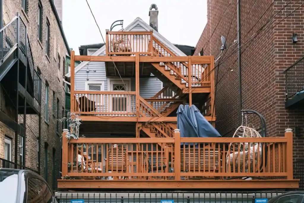 Multi level wooden deck between buildings