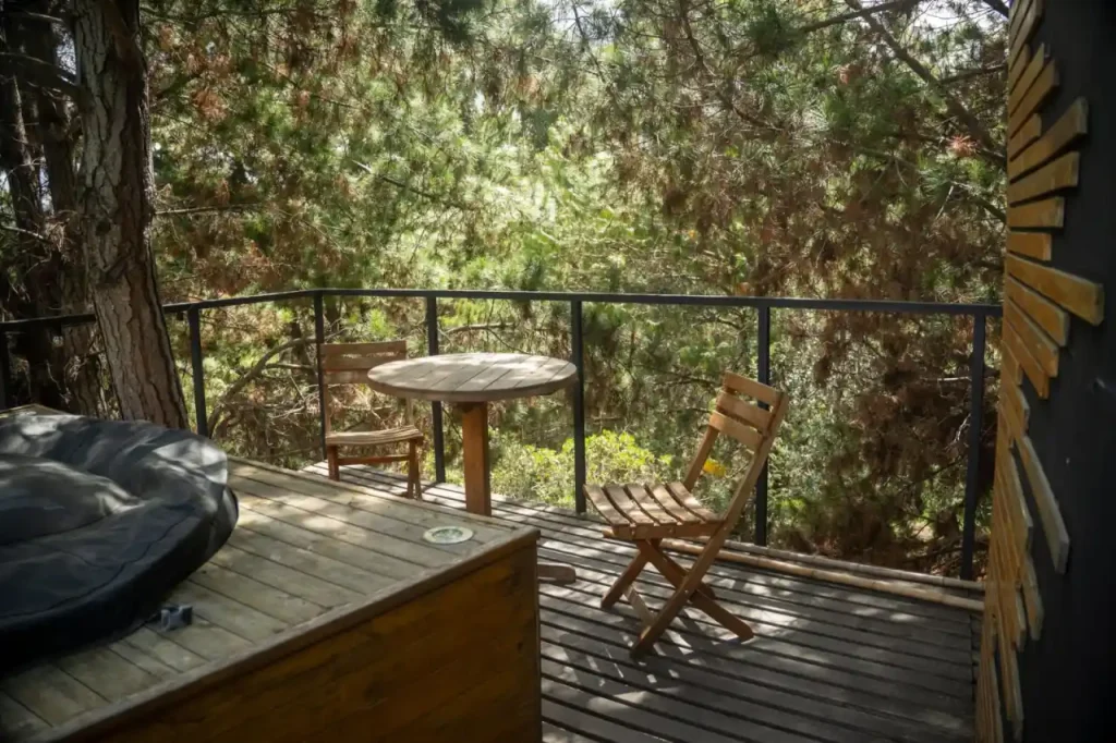 Outdoor balcony deck surrounded by trees