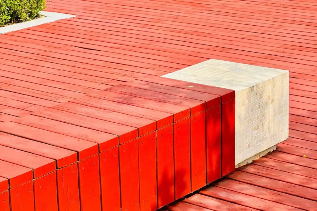 Red wooden deck with benches
