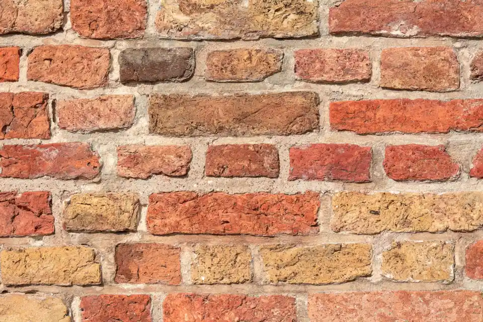 Rough multicoloured brick wall texture