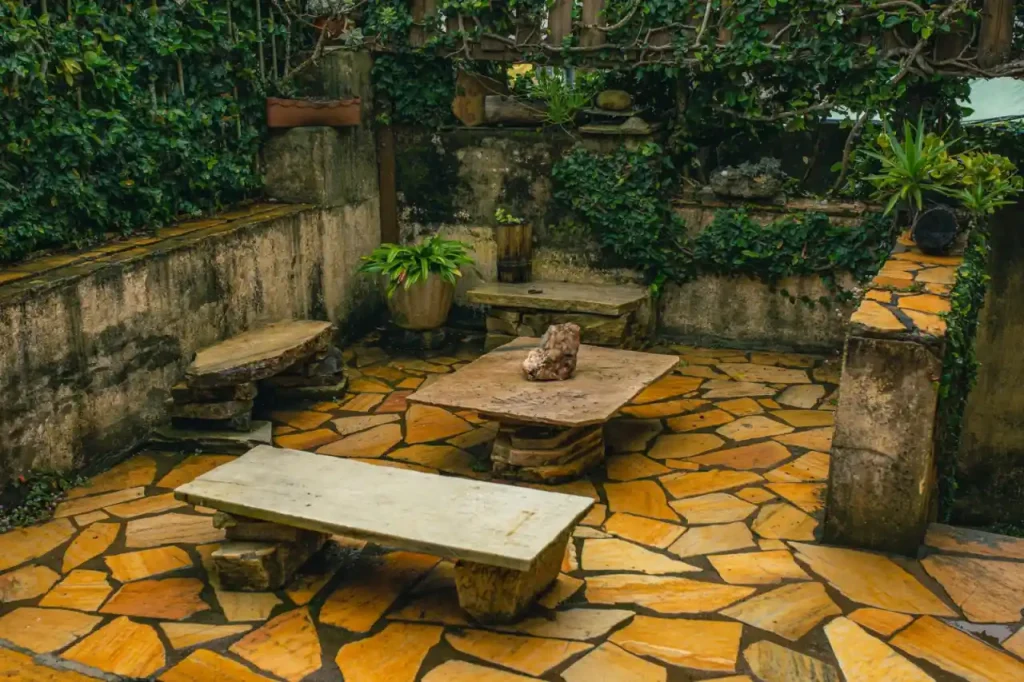 Stone garden patio with ivy covered walls