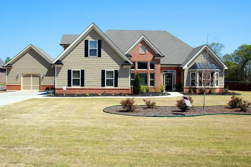 Suburban family house with a large lawn and driveway