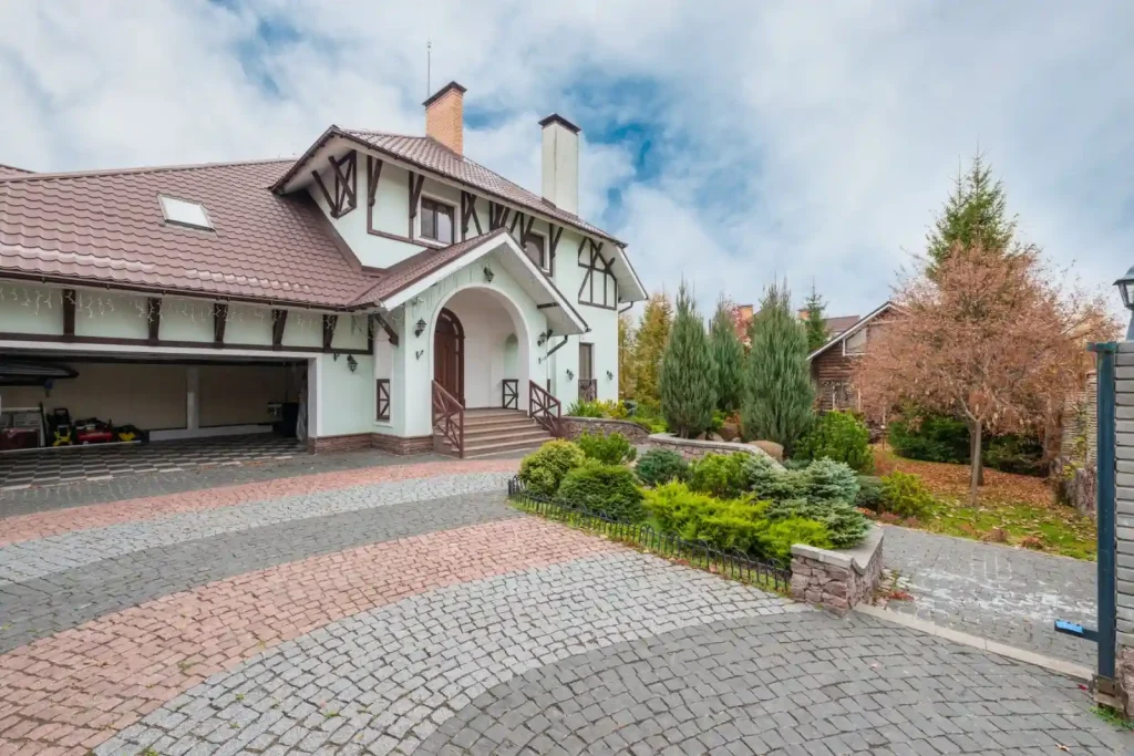 Suburban house with a brick paved driveway