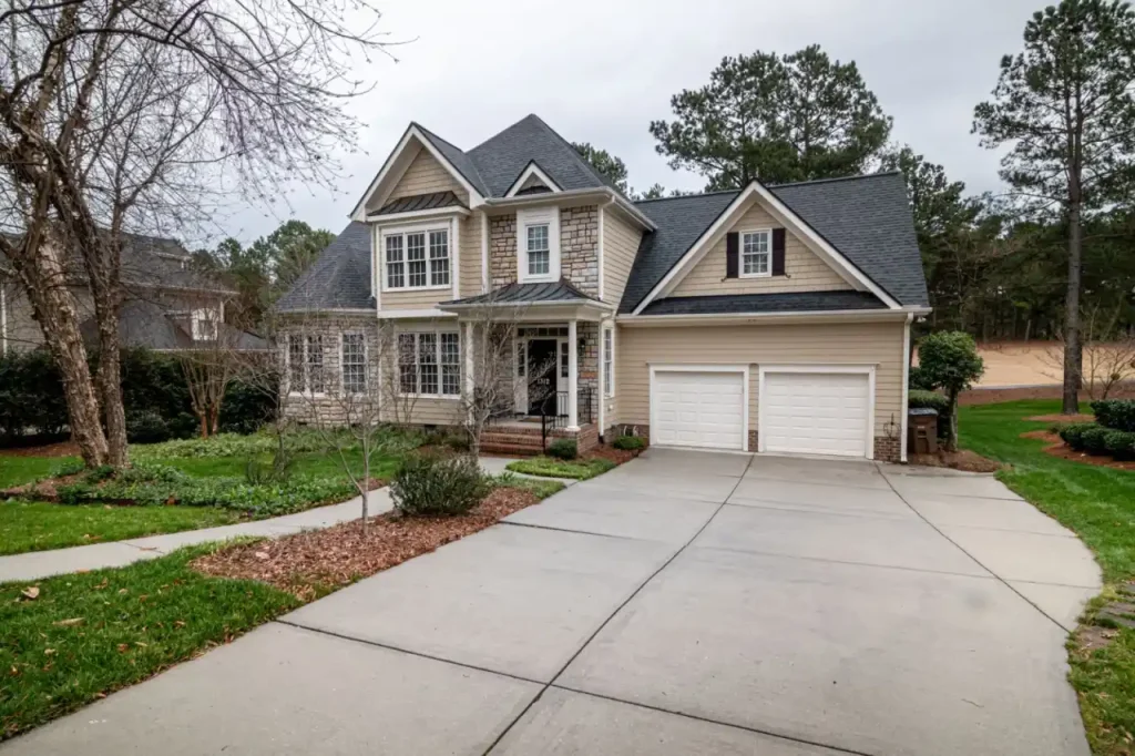 Suburban house with a double garage and clean driveway