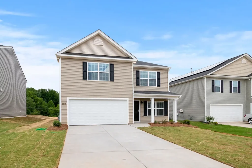Two storey suburban home with driveway and lawn