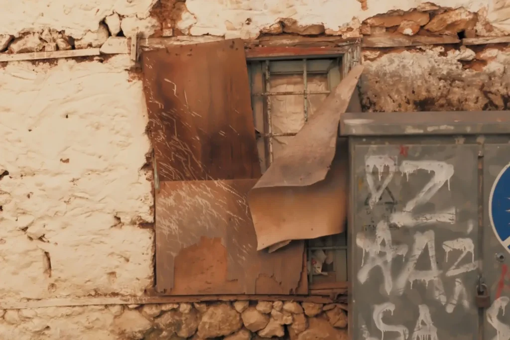 Weathered building with cracked exterior walls