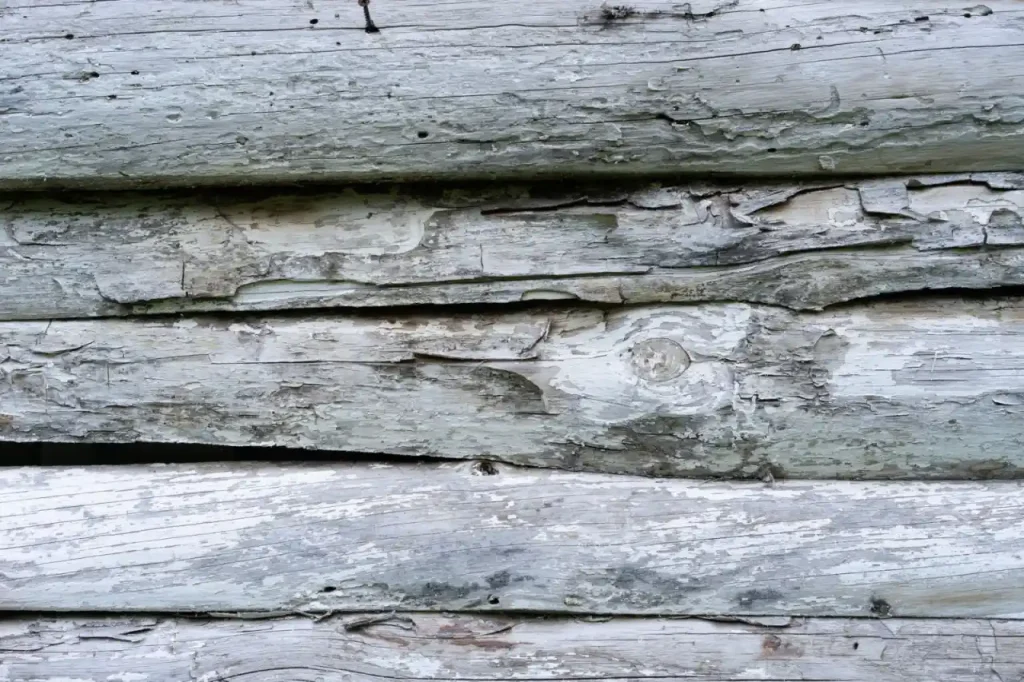 Weathered wooden surface with peeling finish