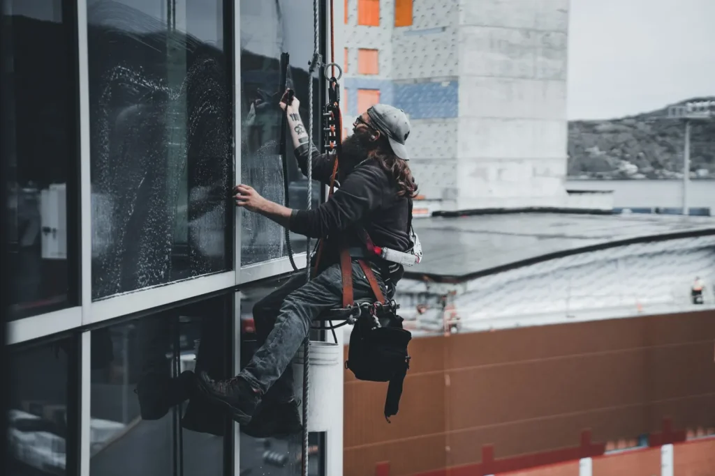 Window cleaner working on a high rise building