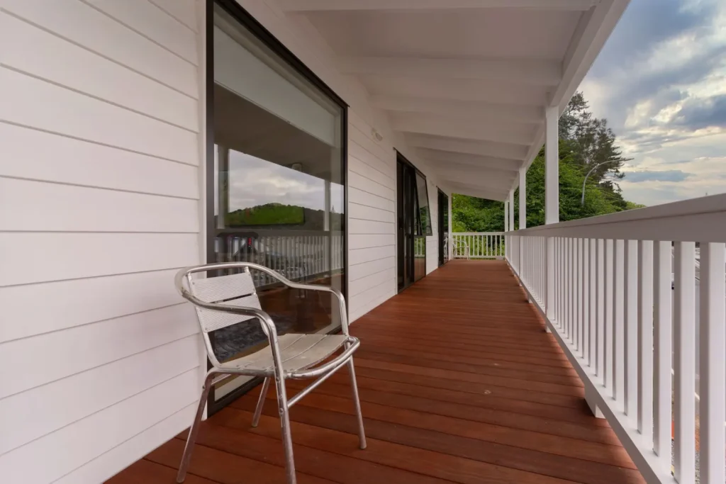Wooden porch decking with a chair